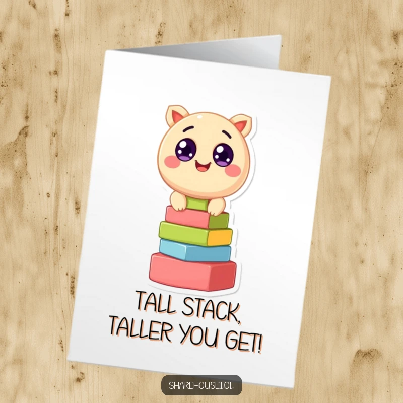 Funny Free Printable Birthday Card: A round creature with big eyes enthusiastically stacks colorful building blocks, ready for a birthday surprise.