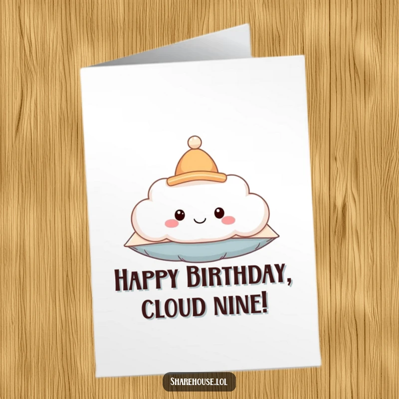Funny free printable birthday card: smiling fluffy cloud pillow wearing a tiny hat, sending birthday cheer.